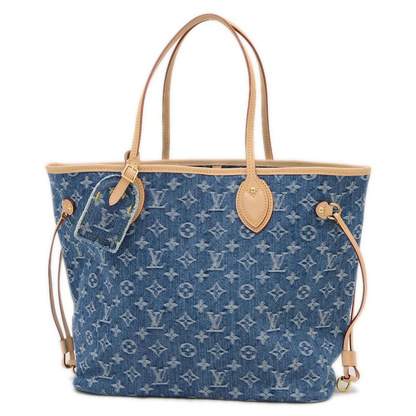Denim neverfull-style tote bag with slim shoulder handles and adjustable side laces on white background