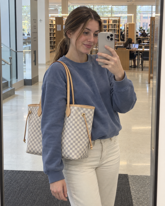 AI-generated styling illustration: white and gray check tote styled for a university day.